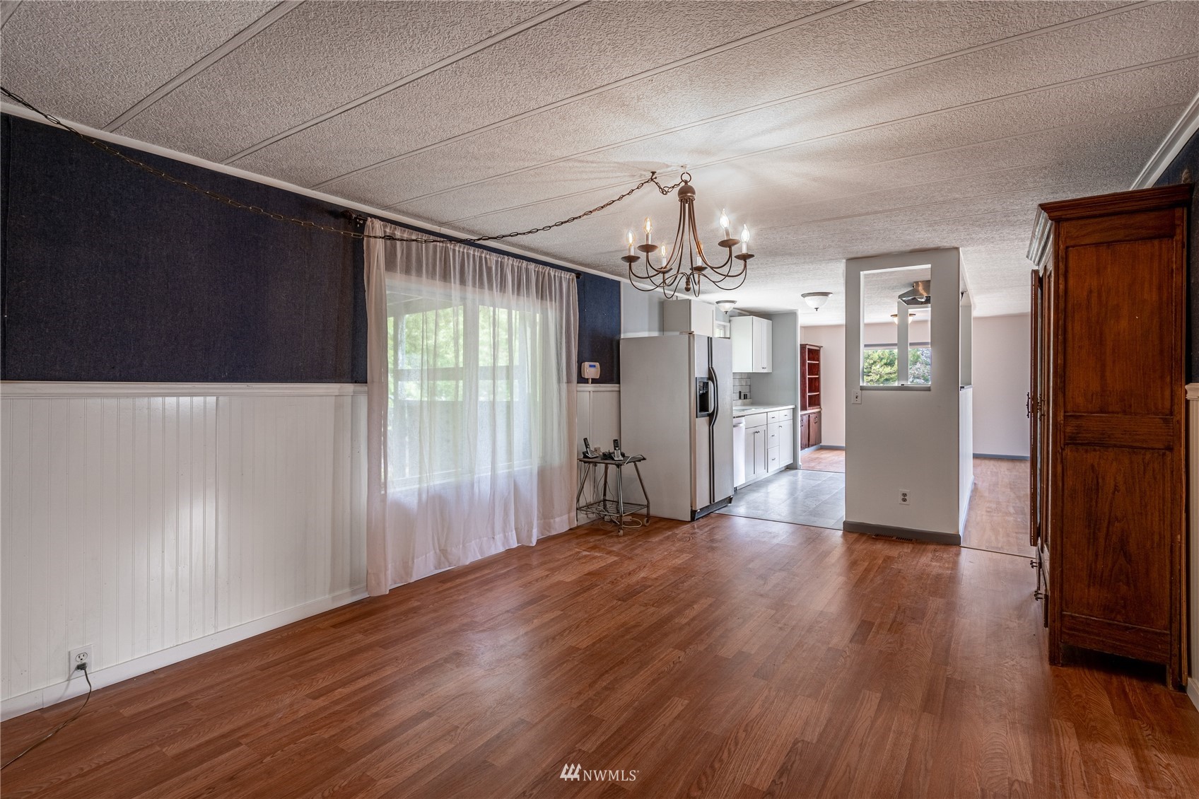 35 Apple Acres Road, Unit 112 Chelan, WA 98816 - Photo 12 of 35 a view of a big room with wooden floor and windows