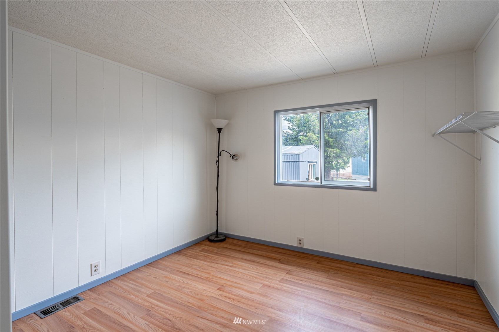 35 Apple Acres Road, Unit 112 Chelan, WA 98816 - Photo 17 of 35 a view of empty room with wooden floor and fan