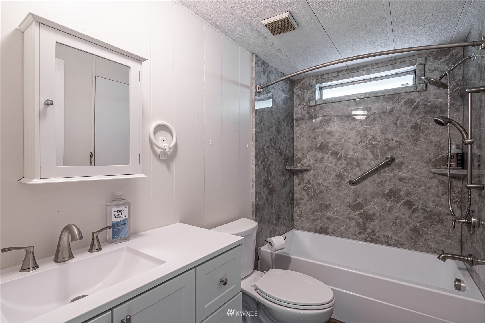 35 Apple Acres Road, Unit 112 Chelan, WA 98816 - Photo 19 of 35 a bathroom with a sink toilet vanity and shower