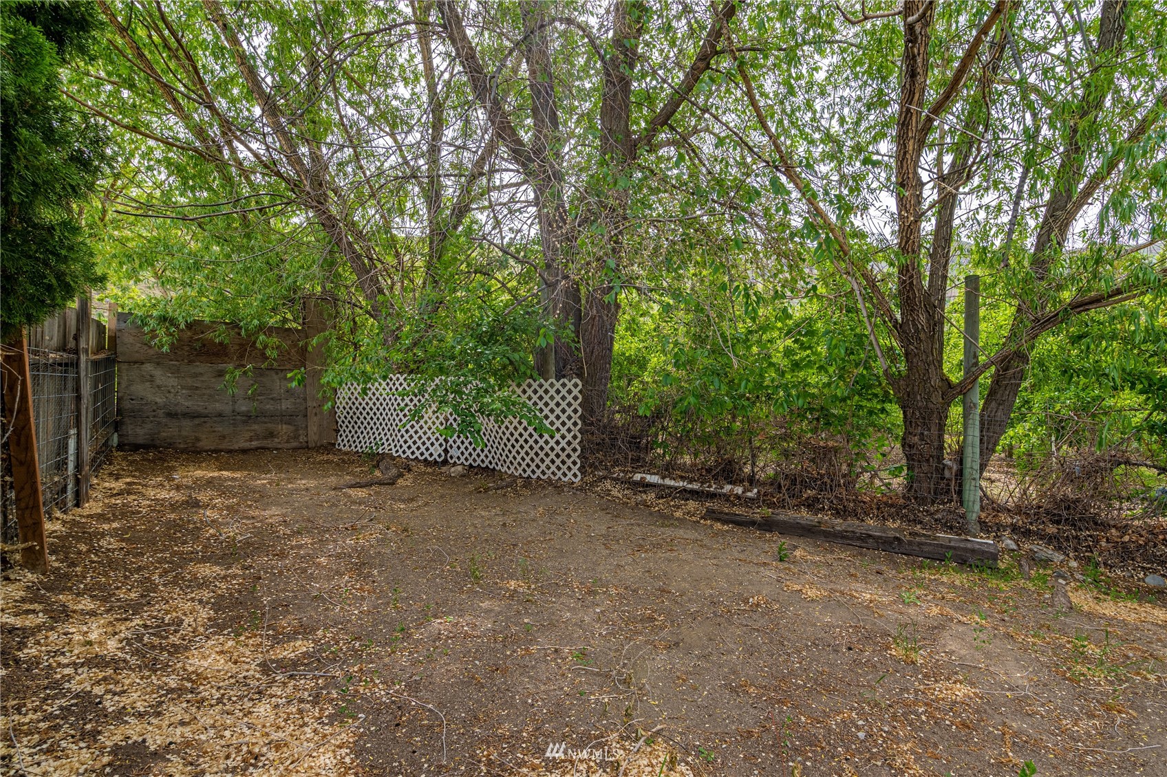 35 Apple Acres Road, Unit 112 Chelan, WA 98816 - Photo 29 of 35 a view of a field with trees in front of it