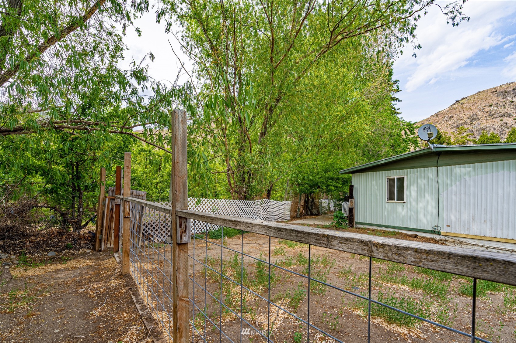 35 Apple Acres Road, Unit 112 Chelan, WA 98816 - Photo 30 of 35 a view of a house with backyard and sitting area