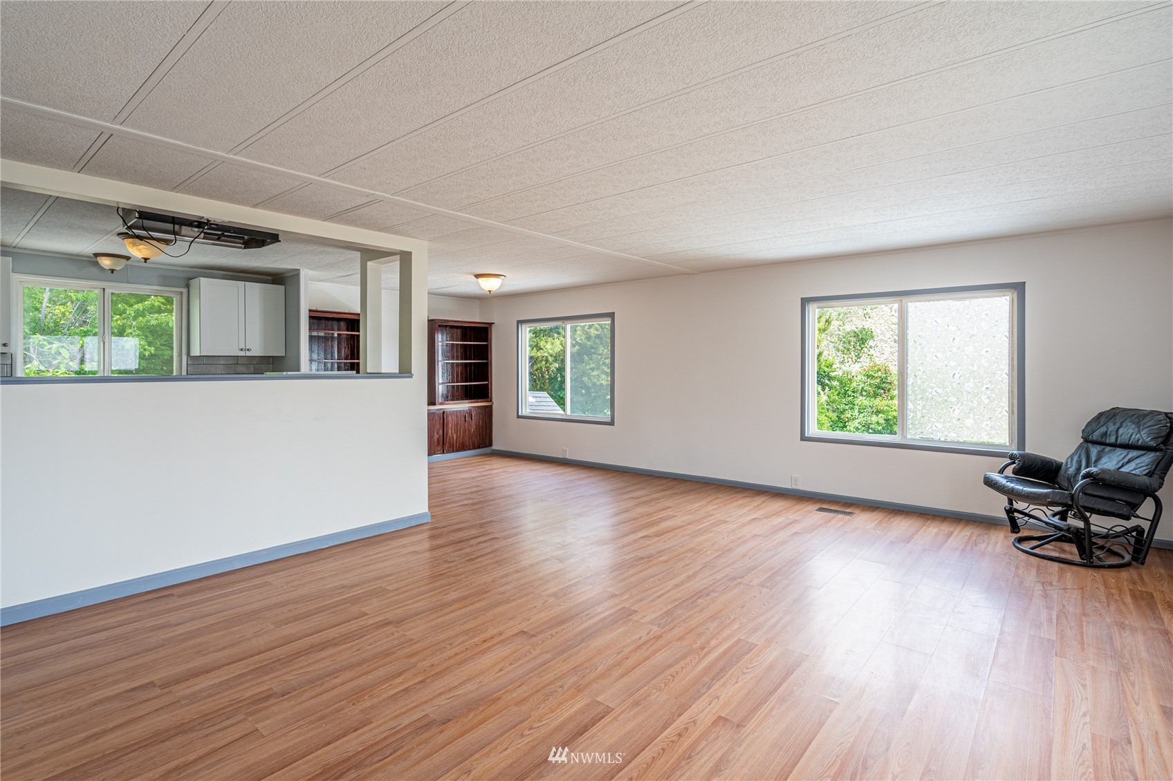 35 Apple Acres Road, Unit 112 Chelan, WA 98816 - Photo 3 of 35 a view of a big room with wooden floor and windows