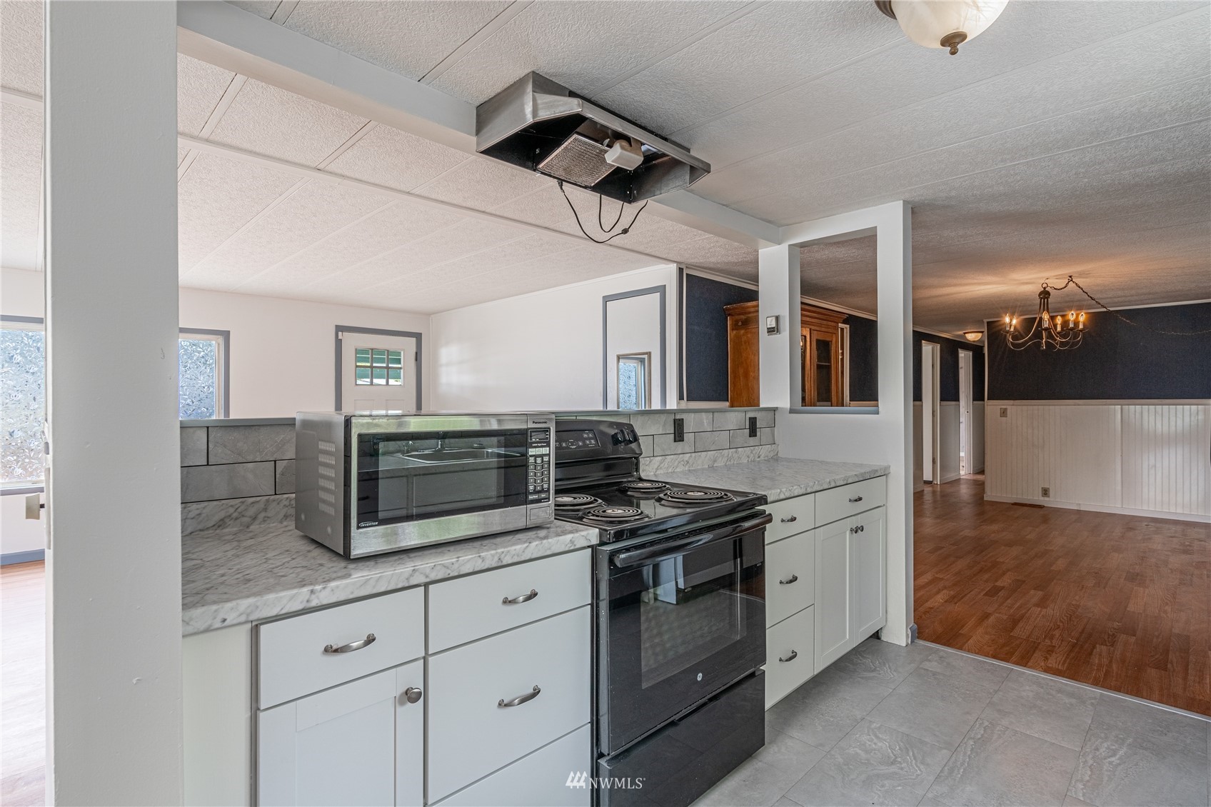 35 Apple Acres Road, Unit 112 Chelan, WA 98816 - Photo 6 of 35 a kitchen with stainless steel appliances granite countertop a sink and a stove
