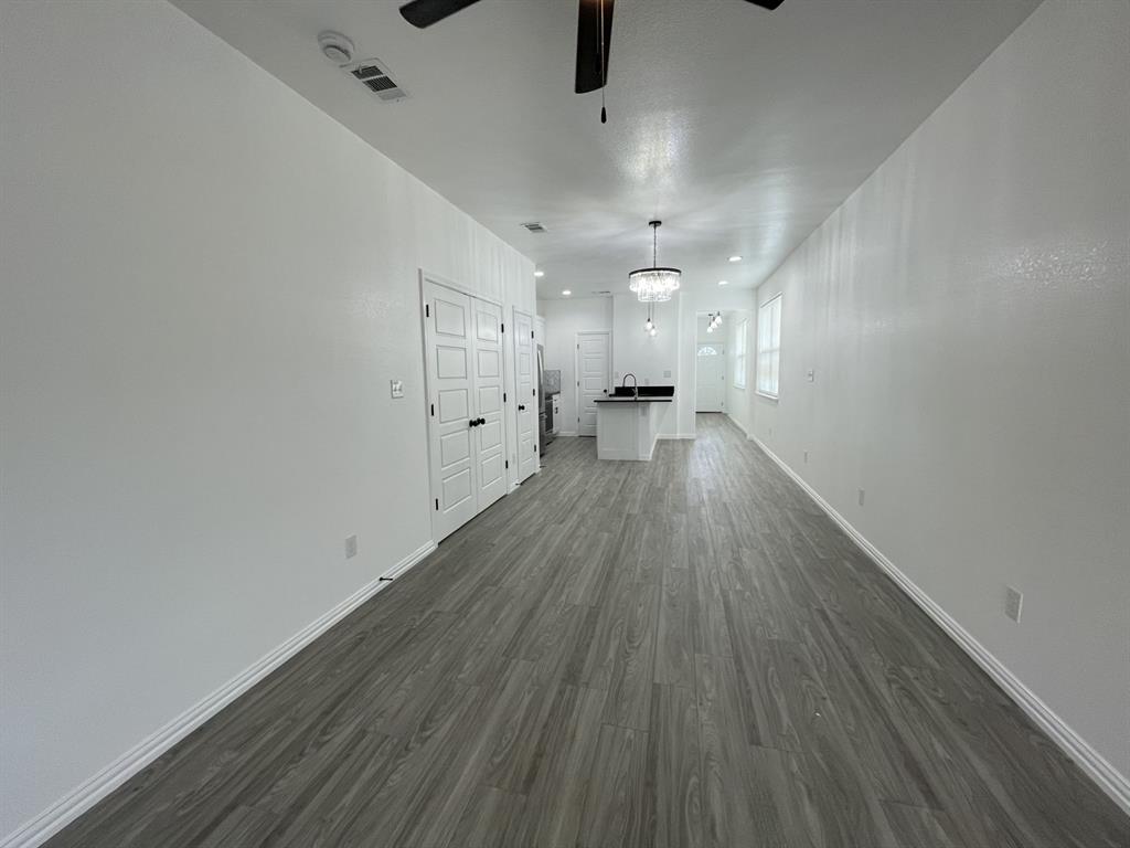 3309 Collin Street Fort Worth, TX 76119 - Photo 7 of 15 a view of a room with wooden floor