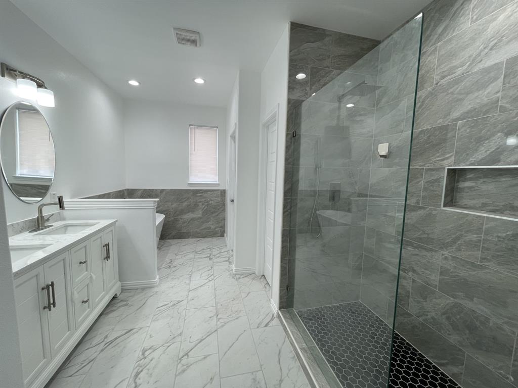 3309 Collin Street Fort Worth, TX 76119 - Photo 9 of 15 a bathroom with a double vanity sink mirror and shower