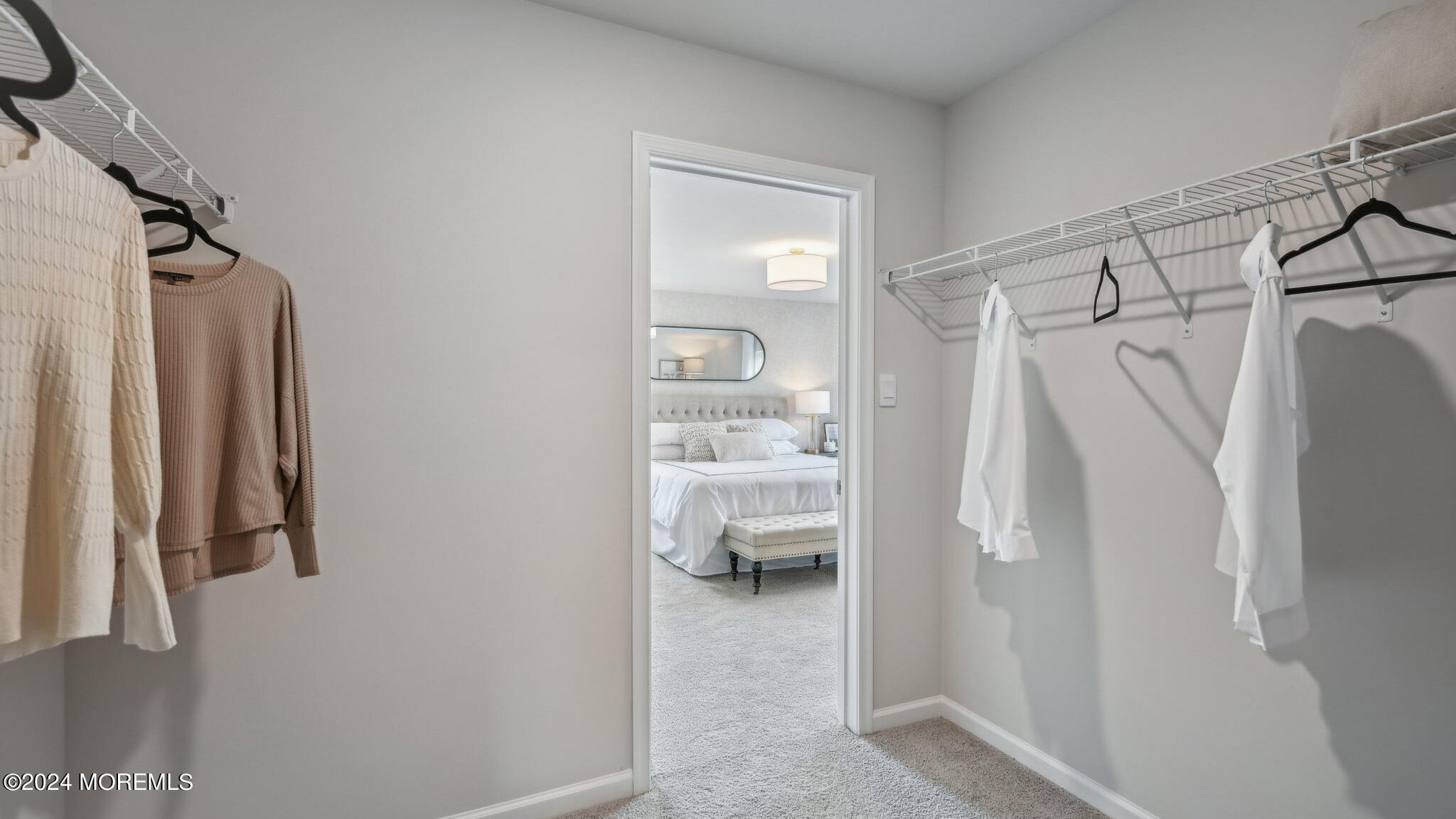 16 Rothbury Court Tinton Falls, NJ 07753 - Photo 37 of 43 a view of walk in closet with clothes and shoes