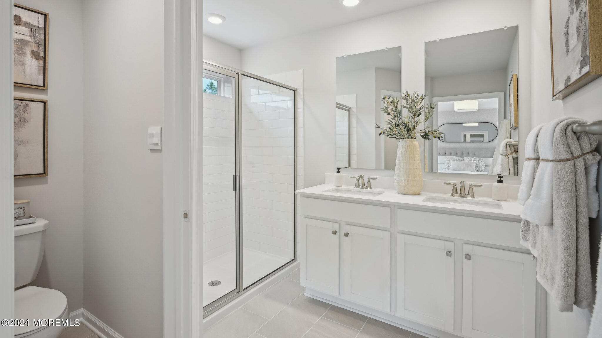 16 Rothbury Court Tinton Falls, NJ 07753 - Photo 39 of 43 a bathroom with a sink and a mirror
