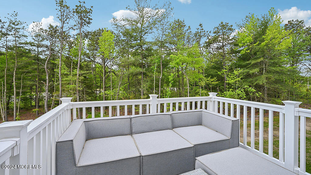 16 Rothbury Court Tinton Falls, NJ 07753 - Photo 40 of 43 a view of a chair and table on the deck