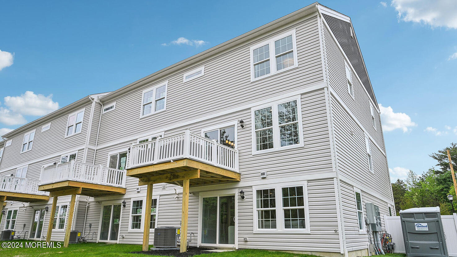 16 Rothbury Court Tinton Falls, NJ 07753 - Photo 42 of 43 a front view of a house with a porch