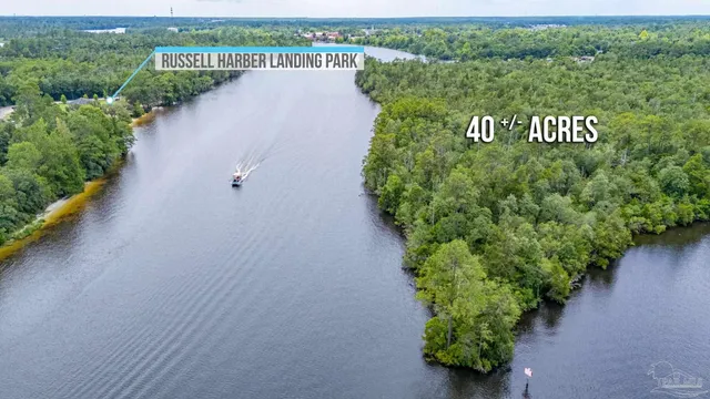 an aerial view of swimming pool patio and outdoor seating