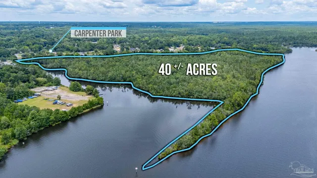 a view of lake with green space