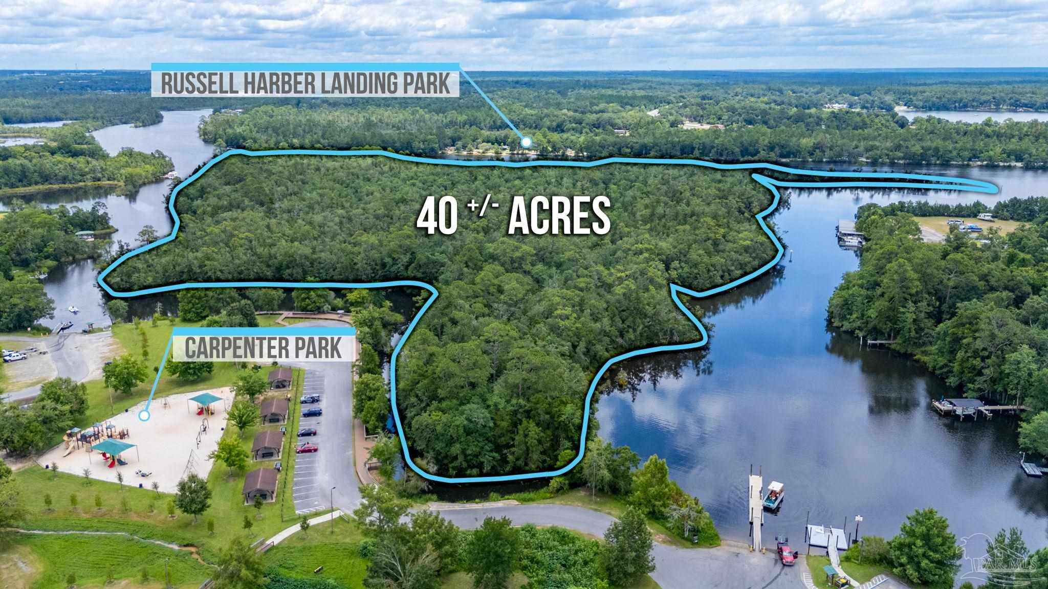 0 Broad Street Milton, FL 32570 - Photo 2 of 36 an aerial view of swimming pool patio and outdoor seating