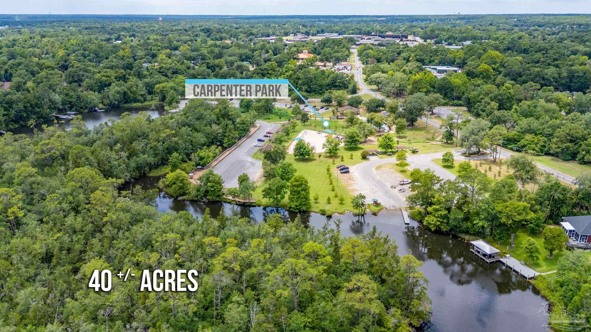 0 Broad Street Milton, FL 32570 - Photo 21 of 36 a view of a street with a building in the background