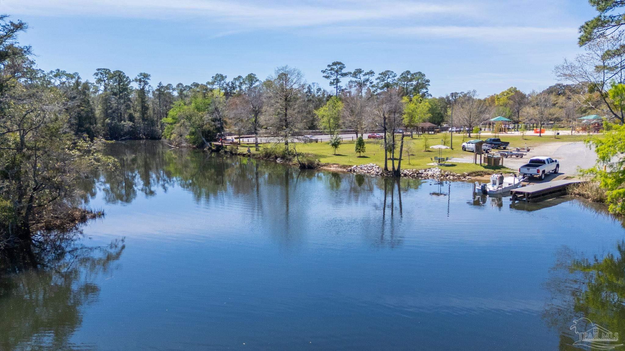 0 Broad Street Milton, FL 32570 - Photo 24 of 36 a view of a lake with a city