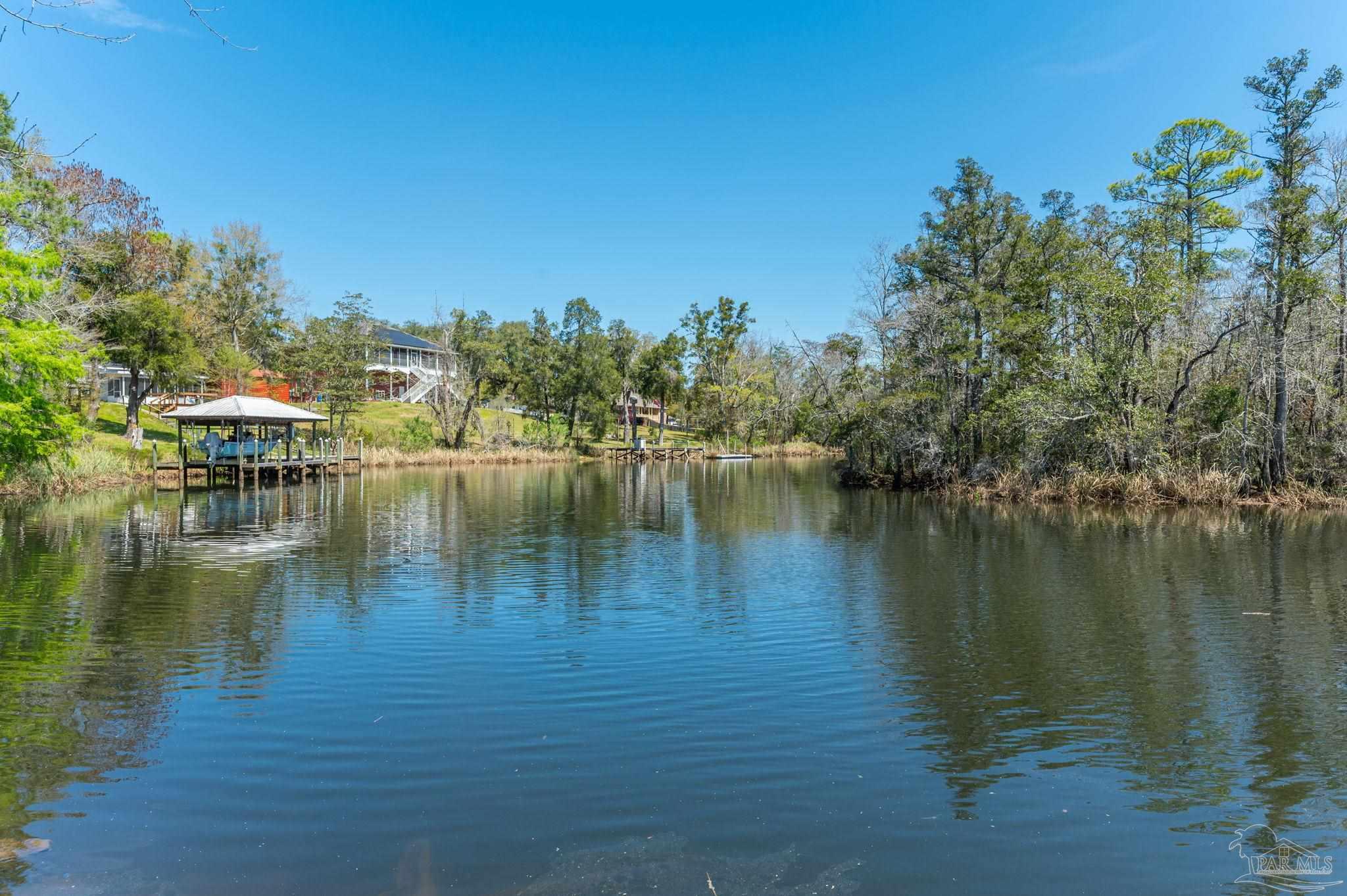 0 Broad Street Milton, FL 32570 - Photo 34 of 36 a view of a lake with houses
