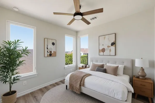 a bedroom with a large bed and a window