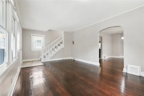 a view of an entryway with wooden floor