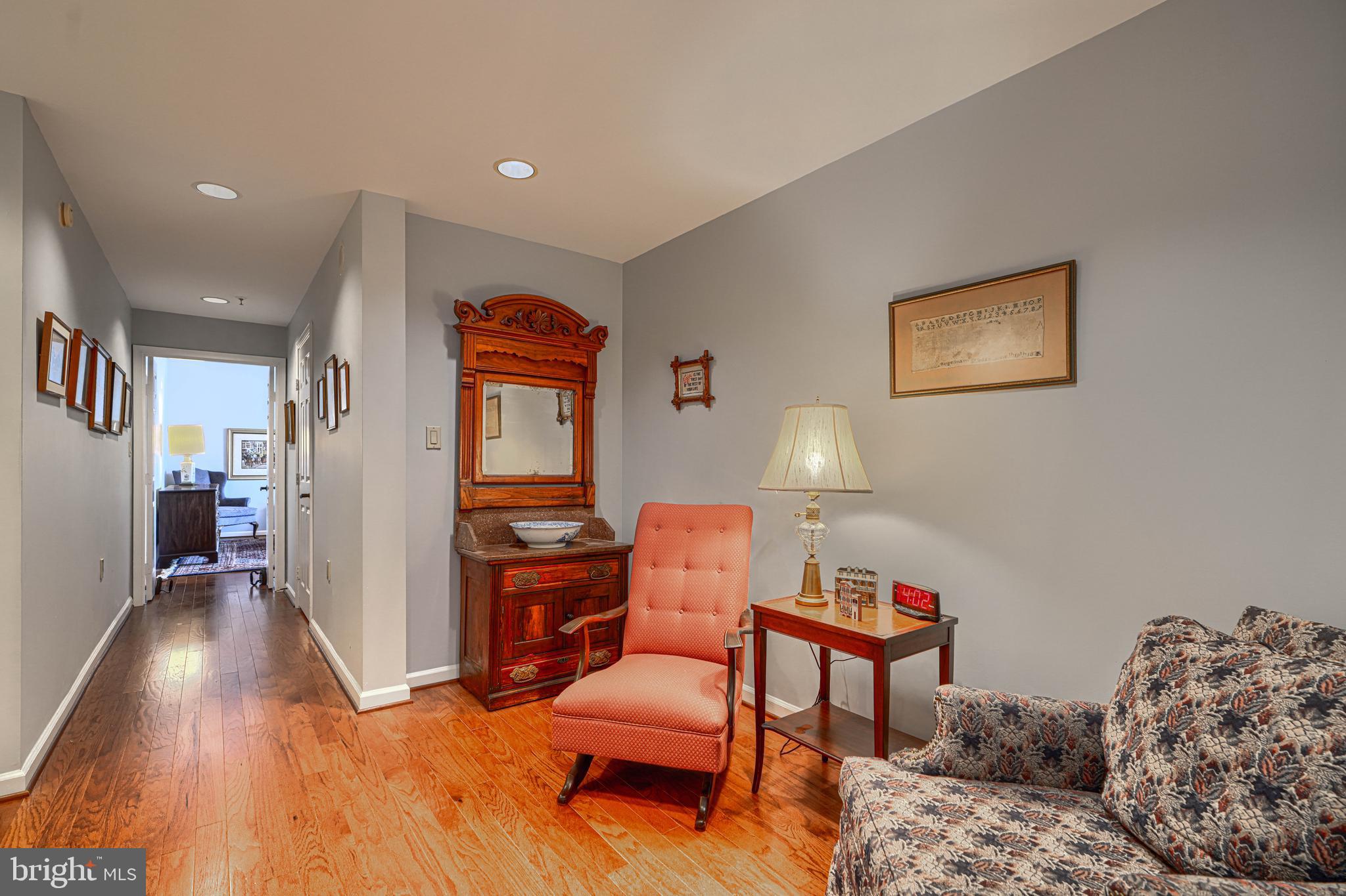 3801 Canterbury Road, Unit 912 Baltimore, MD 21218 - Photo 46 of 79 Sittin area off hallway towards primary bedroom