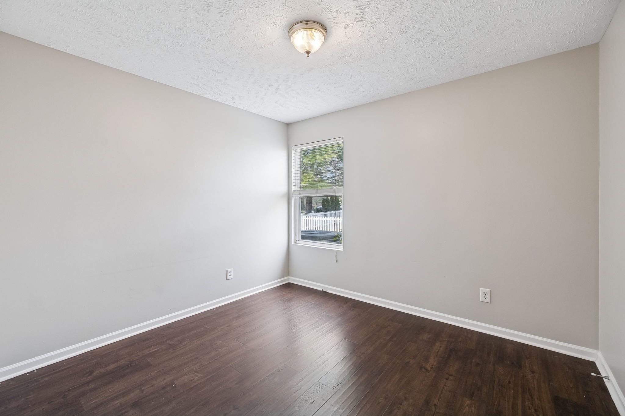 5807 Roxbury Drive Murfreesboro, TN 37128 - Photo 31 of 99 an empty room with wooden floor and windows