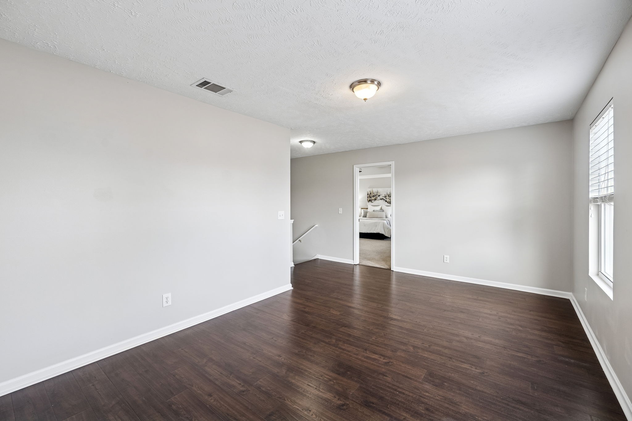 5807 Roxbury Drive Murfreesboro, TN 37128 - Photo 38 of 99 a view of an empty room with wooden floor and a window