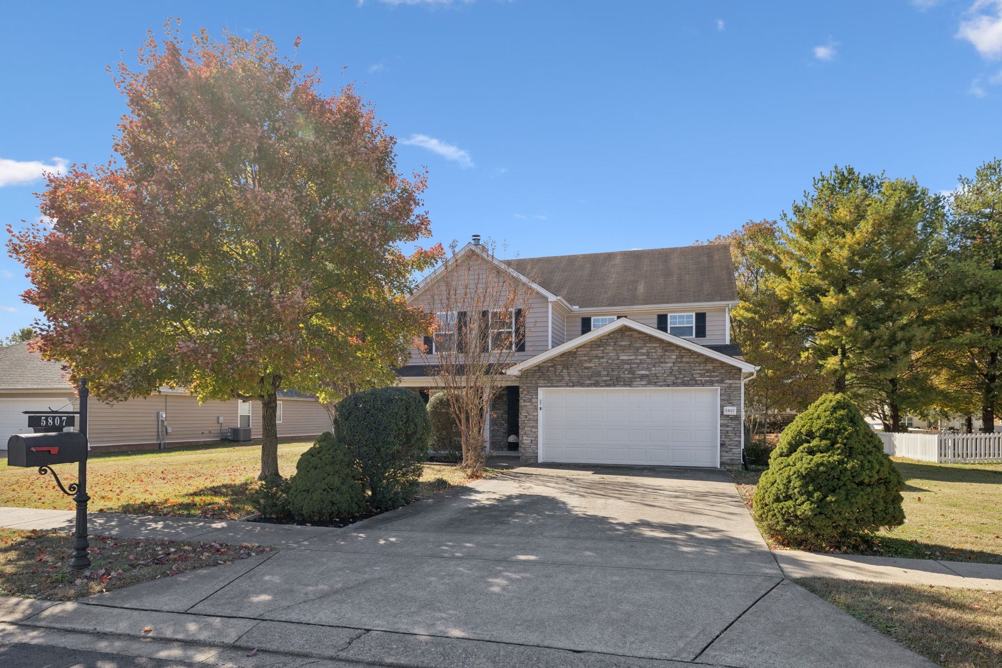 5807 Roxbury Drive Murfreesboro, TN 37128 - Photo 6 of 99 a front view of a house with a yard and garage