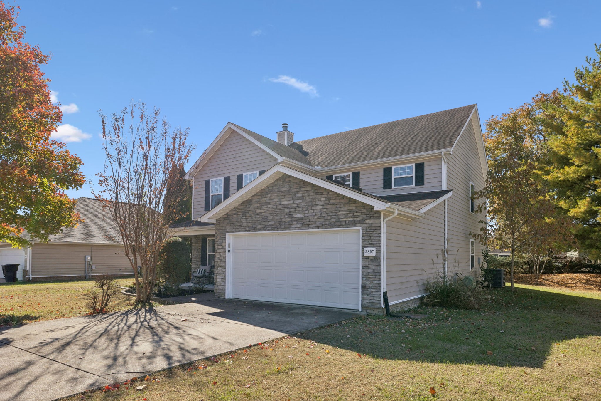 5807 Roxbury Drive Murfreesboro, TN 37128 - Photo 7 of 99 a front view of a house with a yard