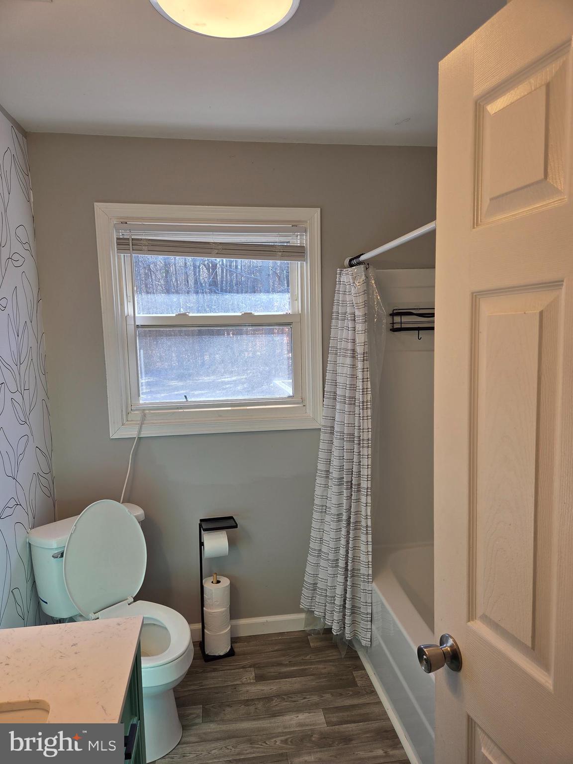6327 Charles Cannon Road Marion Station, MD 21838 - Photo 13 of 23 a bathroom with a toilet a sink and a shower
