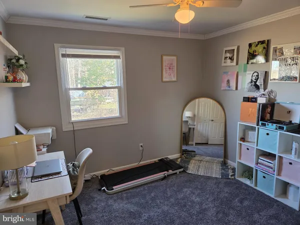 a room with furniture and a window