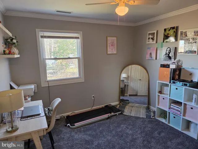 a room with furniture and a window