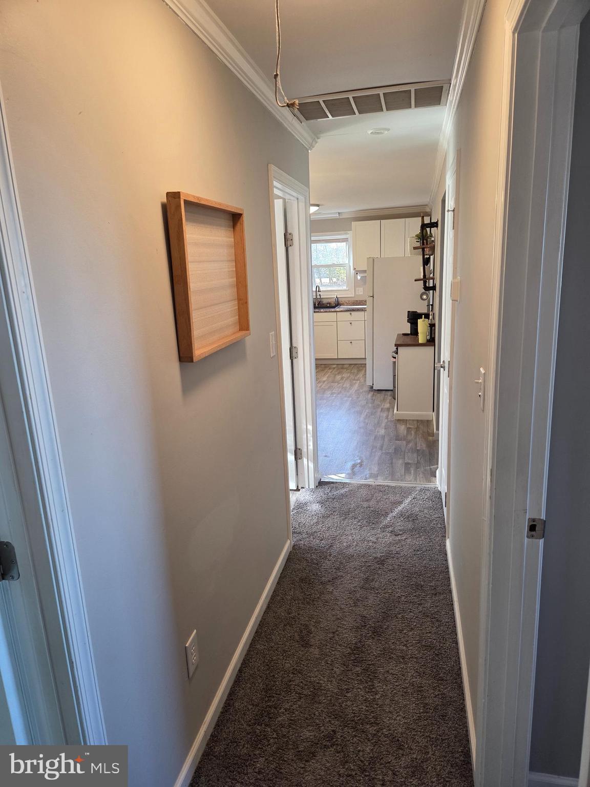 6327 Charles Cannon Road Marion Station, MD 21838 - Photo 18 of 23 a view of hallway with a bathroom and a sink