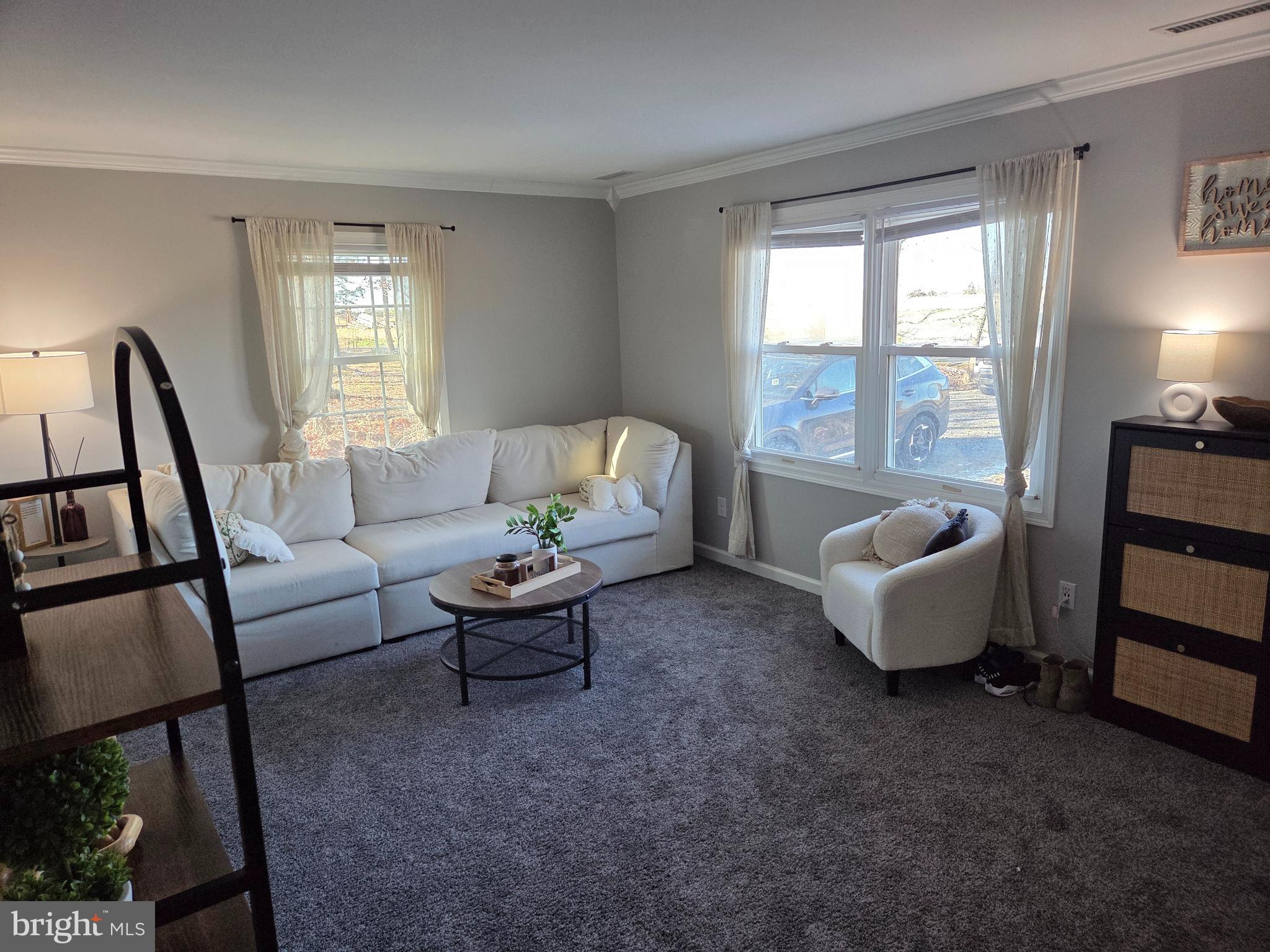 6327 Charles Cannon Road Marion Station, MD 21838 - Photo 3 of 23 a living room with furniture and a large window