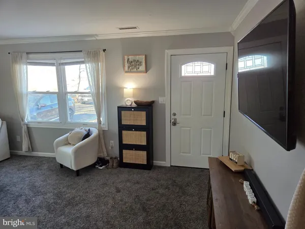 a living room with furniture and windows
