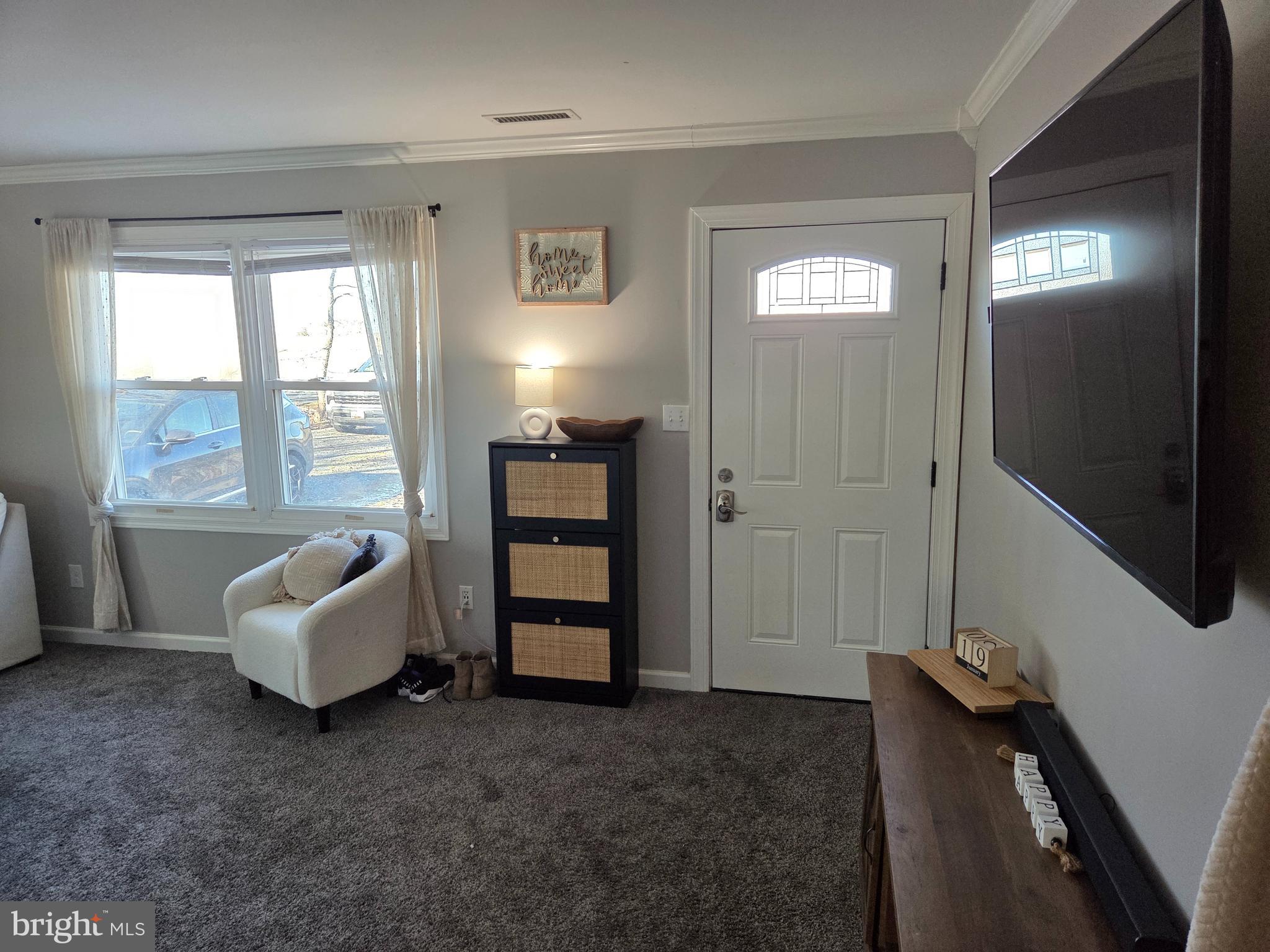 6327 Charles Cannon Road Marion Station, MD 21838 - Photo 4 of 23 a living room with furniture and windows