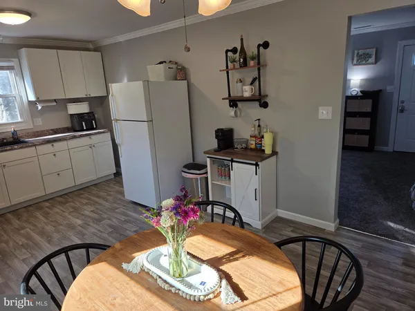 a kitchen with stainless steel appliances granite countertop a refrigerator a stove a sink dishwasher and microwave