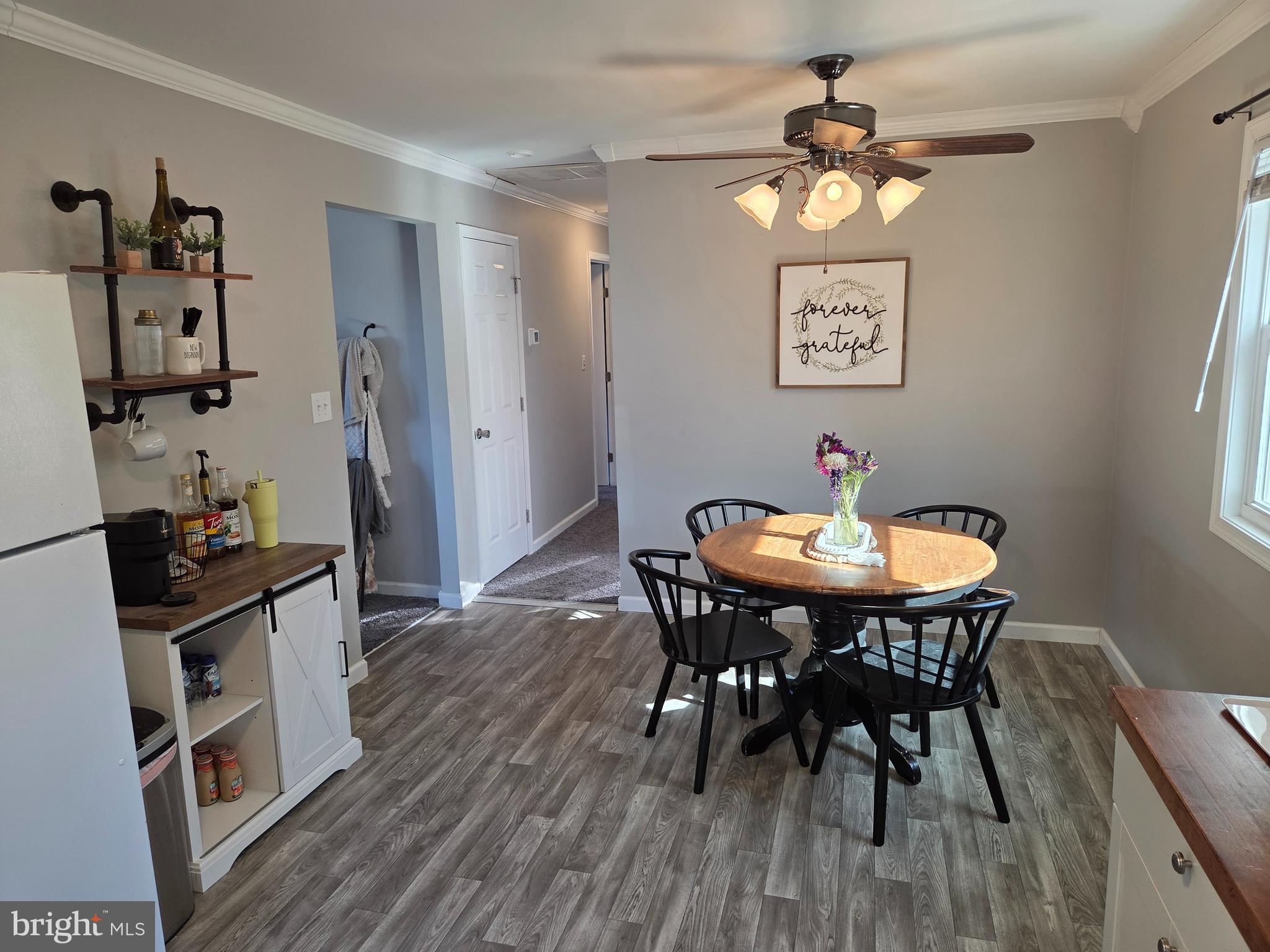 6327 Charles Cannon Road Marion Station, MD 21838 - Photo 10 of 23 a view of a dining room with furniture and wooden floor