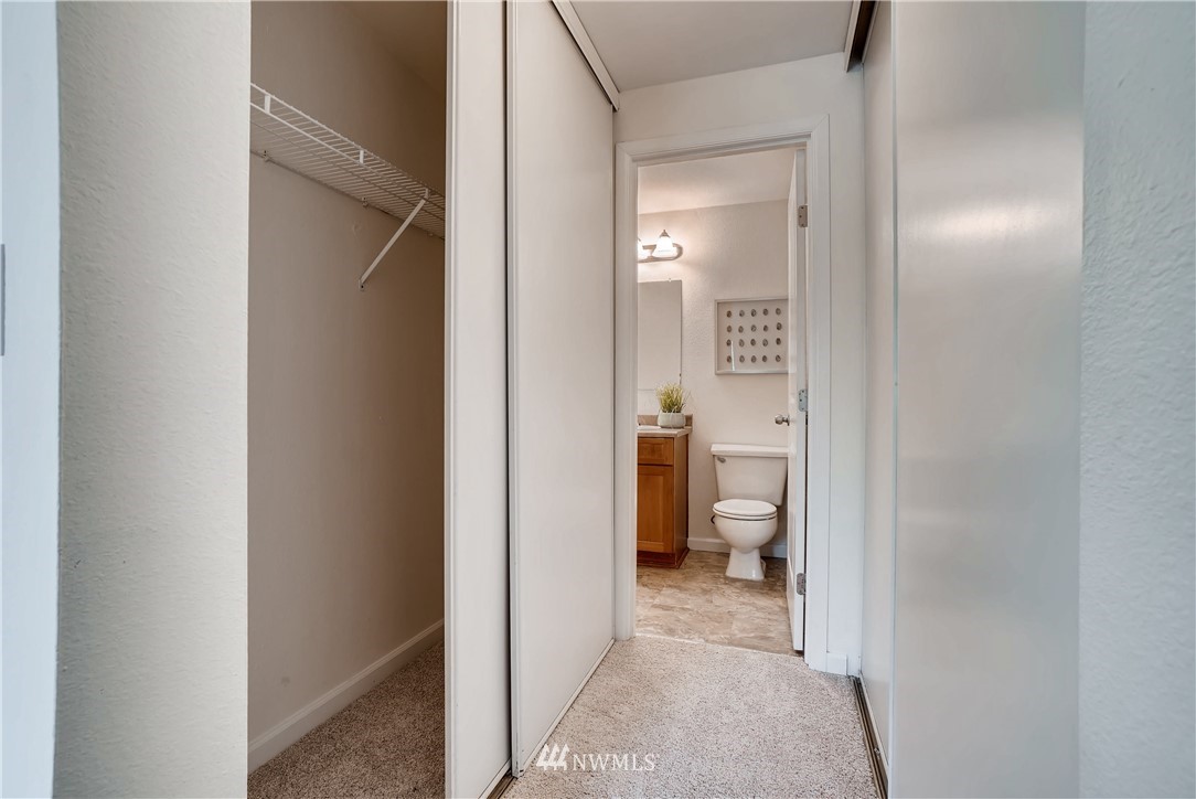 10831 Northeast 147th Lane, Unit R201 Bothell, WA 98011 - Photo 12 of 17 a view of a bathroom from a hallway