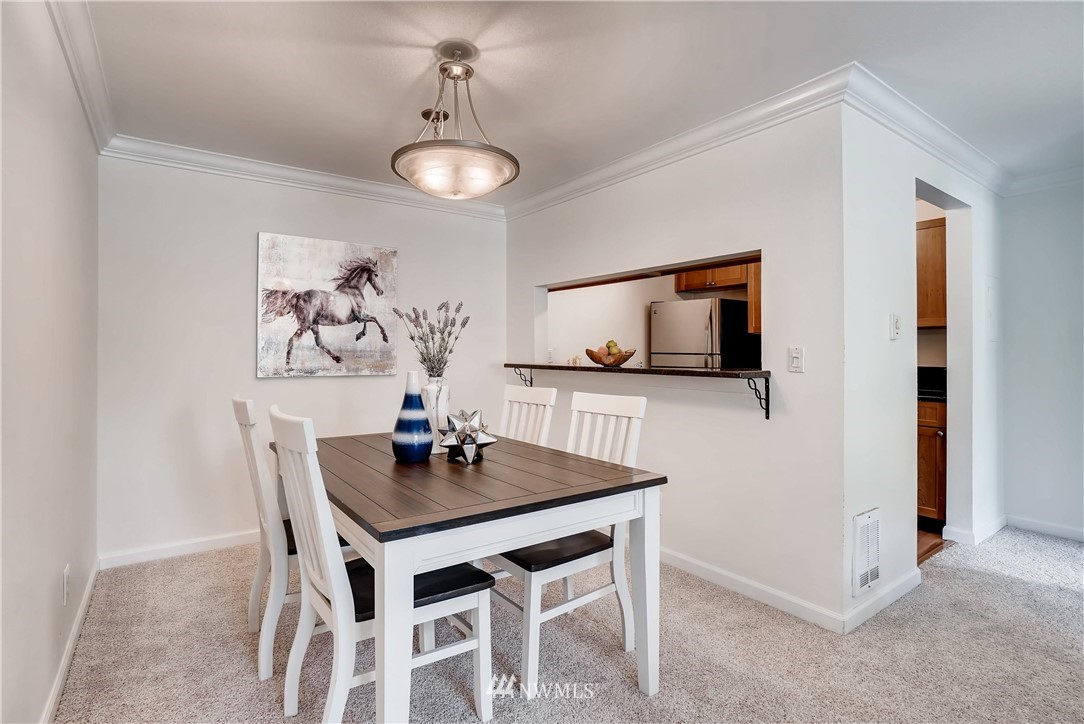 10831 Northeast 147th Lane, Unit R201 Bothell, WA 98011 - Photo 5 of 17 a dining room with furniture and window