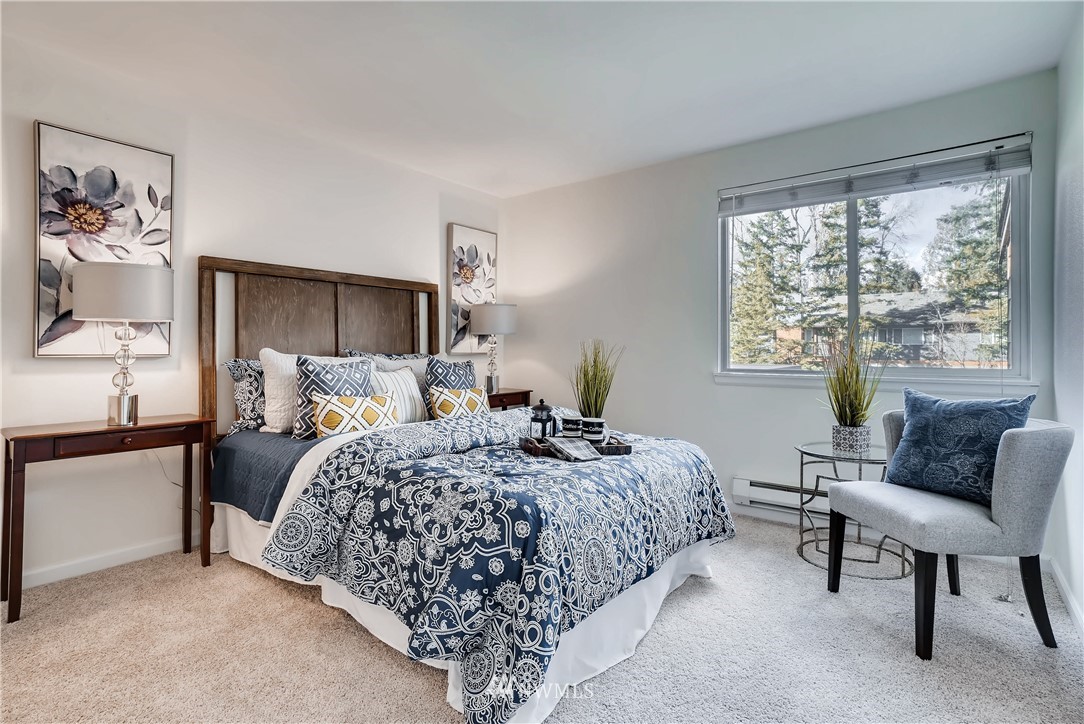 10831 Northeast 147th Lane, Unit R201 Bothell, WA 98011 - Photo 10 of 17 a bedroom with bed and a window