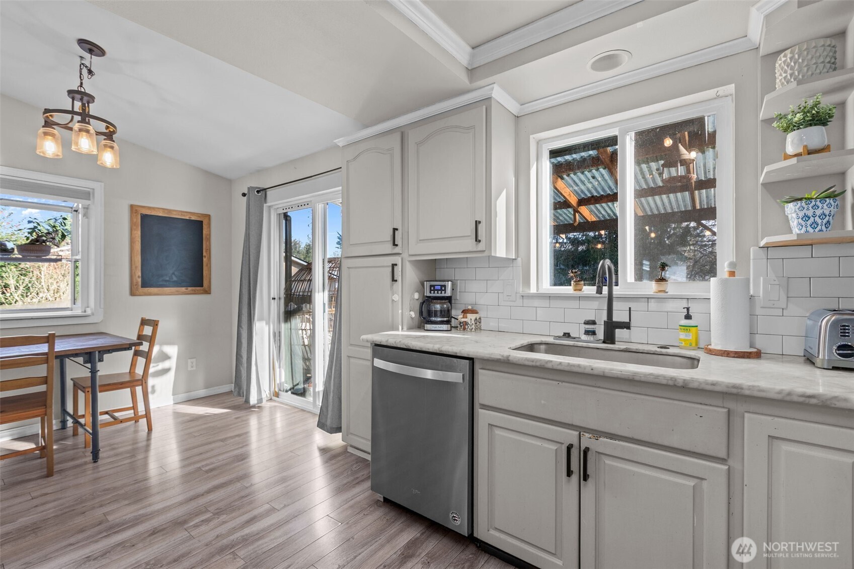 20911 Ronning Road Arlington, WA 98223 - Photo 13 of 40 a kitchen with a sink cabinets stainless steel appliances and a window