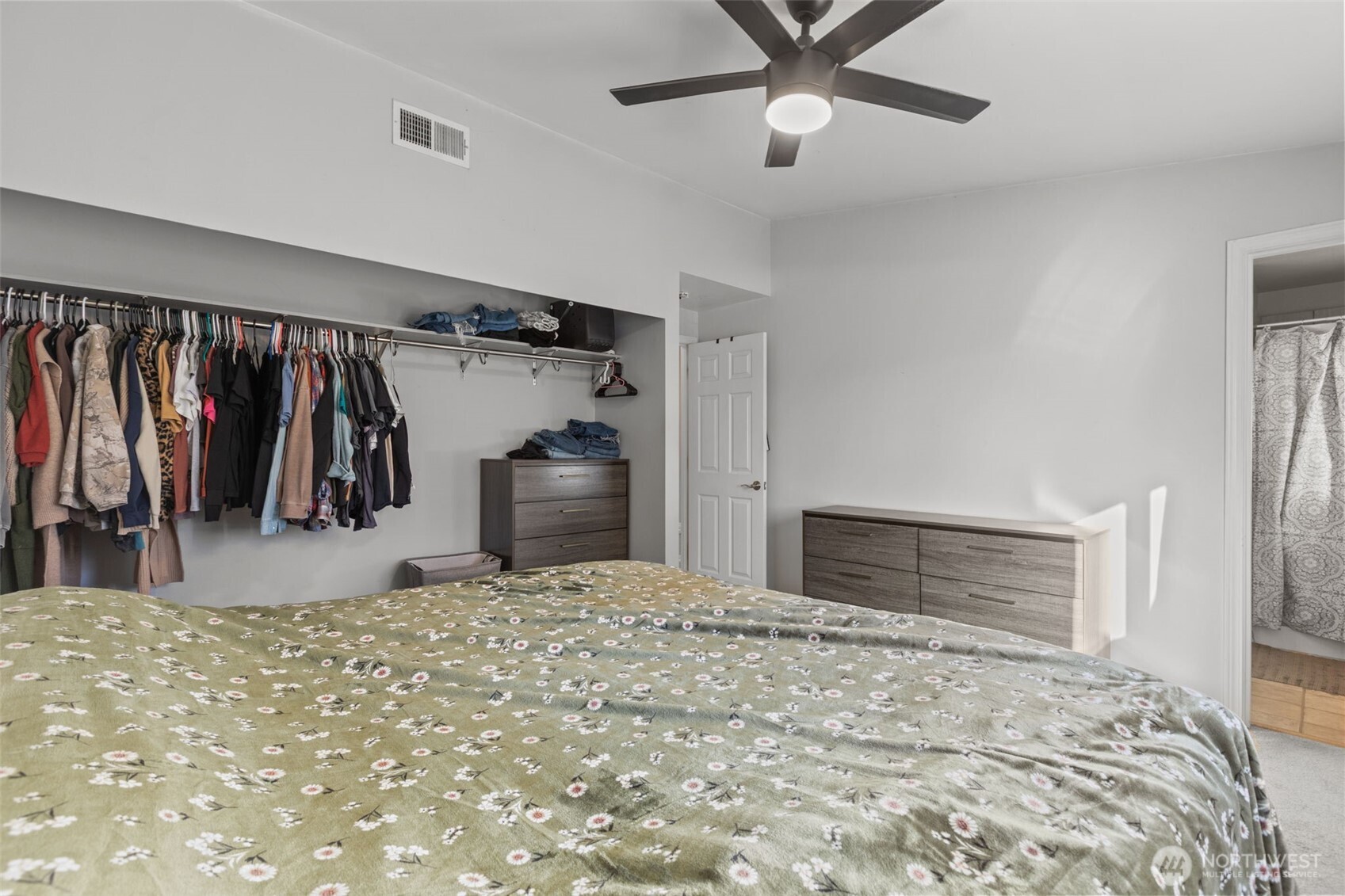 20911 Ronning Road Arlington, WA 98223 - Photo 17 of 40 a bedroom with a bed and a ceiling fan