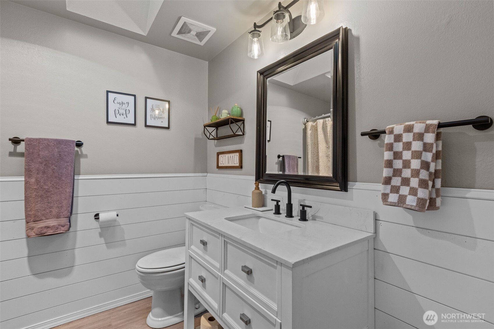 20911 Ronning Road Arlington, WA 98223 - Photo 24 of 40 a bathroom with a toilet sink and mirror