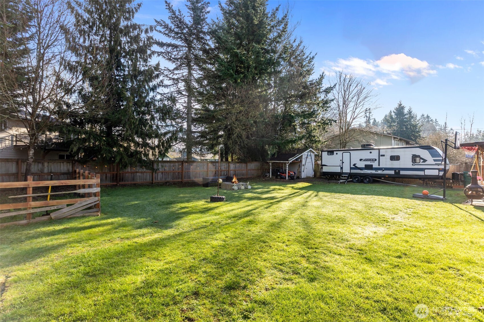 20911 Ronning Road Arlington, WA 98223 - Photo 38 of 40 a view of a swimming pool with a big yard and large trees
