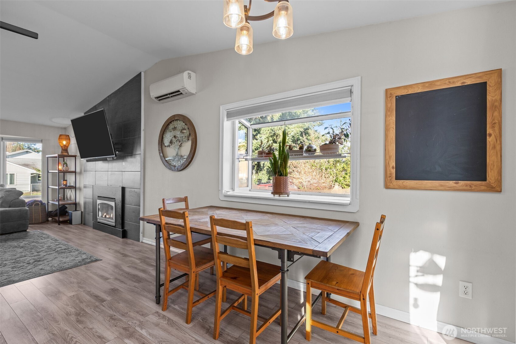 20911 Ronning Road Arlington, WA 98223 - Photo 9 of 40 a view of a dining room with furniture window and wooden floor