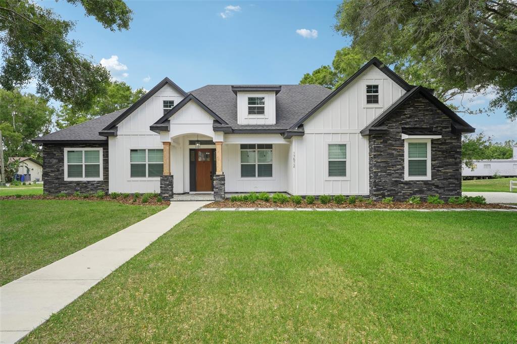 17512 Marsh Road Lutz, FL 33558 - Photo 1 of 1 a front view of a house with a yard