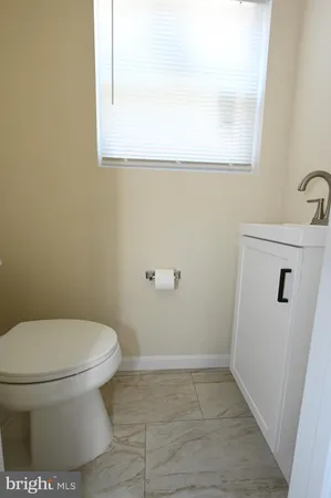 a bathroom with a toilet and a sink
