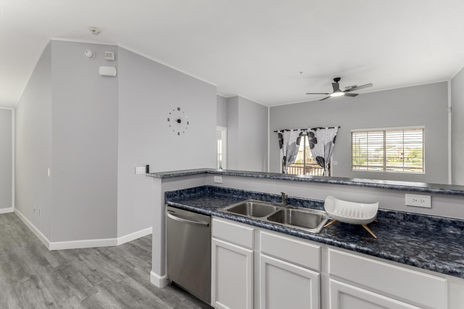 1350 South Greenfield Road, Unit 2205 Mesa, AZ 85206 - Photo 19 of 42 a kitchen with a sink and cabinets