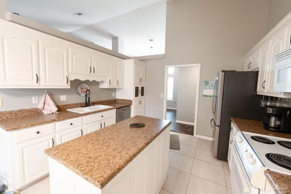 a view of a dining room with furniture and window