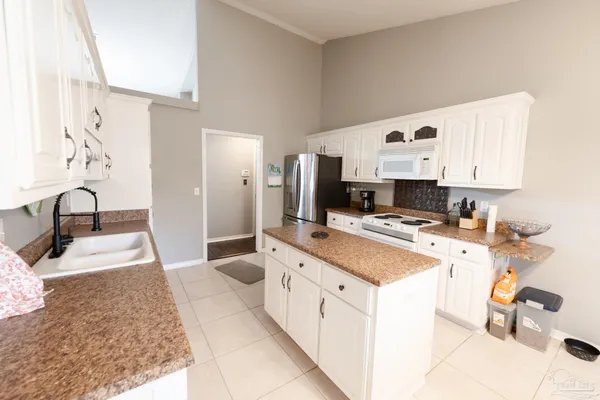 a living room with fireplace furniture and a wooden floor