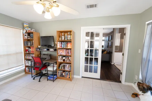 a view of a roof deck with couches and potted plants