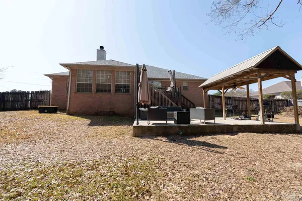 a swimming pool with wooden fence